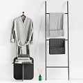 Bathroom Accessories Featuring Grey Bathrobe On Wooden Hanger And Textured Towels On Black Metal Rack