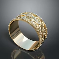 Ornate Gold Bracelet With Intricate Floral Carvings And Sparkling Diamond Accents