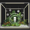 Artistic Floral Display Installation With Green Plants Flowers And Lighting In Glass Case