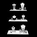 Jewelry Showcase On White Display Stands With Necklace Mannequins And Small Accessories