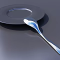 Modern Sleek Tableware Set with Plate and Spoon on Dark Surface