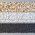 Natural Colored Stones in Brown White Black Tones Arranged as Decorative Strips