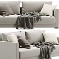Beige Two Seater Sofa With Soft Gray And White Pillows And Warm Knitted Blanket