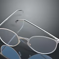 Modern Sleek Silver Frame Glasses With Transparent Lenses On Smooth Surface 3d model