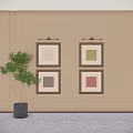 Framed Abstract Paintings On Wall With Green Plant In Bright Interior