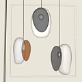 Modern Irregular Shaped Pendant Lights Illuminated With Transparent Brown Black White Tones In Grey Interior