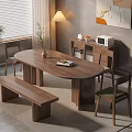 Walnut Oval Dining Table Set With Bench Chairs Potted Plant Lamp And Wall Artwork