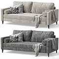 Modern Gray Two Seater Sofa With Cozy Throw Pillows And Stylish Throw Blanket