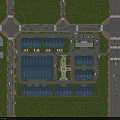 Industrial Factory Complex with Multiple Buildings Blue Roofs Surrounded by Greenery Parking and Roads