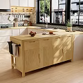 Light Wood Kitchen Sideboard With Simple Design Countertop Holding Fresh Fruits And Utensils