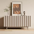 Modern Beige Fluted Entryway Console Cabinet With Green Plant Small Figurine And Wall Art