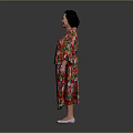 Woman Wearing Colorful Floral Dress With Red Green Patterns And White Shoes On Dark Background