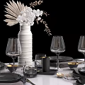 Elegant Tableware Set with Black Plates Gold Cutlery Wine Glasses And Linen Napkins