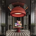 Hotel Lobby Interior Featuring Large Red Chandelier Colorful Flower Arrangement And Decorative Plants