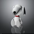 Snoopy Toy Figurine In Sitting Pose With White Body Black Ears Red Collar
