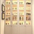 Glass Door Display Cabinet With Light Gray Frame And Multiple Shelves For Arranged Collectible Figures