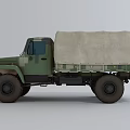 Military Green Truck with Canvas Covered Cargo Bed and Off-Road Exterior Design