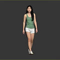 Woman In Green Tank Top And White Shorts Walking On Gray Background With White Shoes