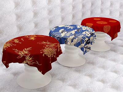 Three Round Stools With Red Blue Floral Pattern Covers And White Bases On Textured Background 3d model