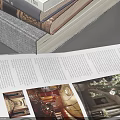 Assorted Stacks of Books and Open Magazine with Colored Covers and Layouts
