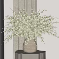 White Flowers in Beige Vase on Small Table with Tablecloth by Window with Mountain View