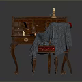 Vintage Wooden Antique Desk With Small Decorative Items And Cloth On Chair