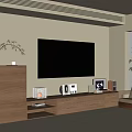 Modern Wooden TV Stand with Decorative Items and Wall-Mounted TV Nearby Plant Chair