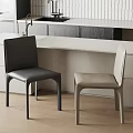 Modern Kitchen Interior With Black And Beige Dining Chairs And White Countertop