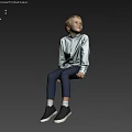 Blonde Young Boy Sitting On Floor In Light Shirt Dark Pants Black Shoes Light Background