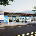 Modern Bus Stop Shelter With Advertising Boards Near Waterfront And Trees Along Road