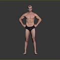 Muscular Shirtless Man Standing With Hands On Hips In Black Swim Trunks Against Gray Background