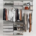 Organized Open Closet With Hanging Clothes Drawers Shoe Storage And Brown Bag