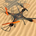 Black And Orange Quadcopter Drone With Propeller Guards On Sandy Ground 3d model