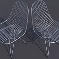 Modern Metal Wire Lounge Chairs With Curved Design And Sleek Legs Pair