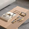 Modern Metal Cabinet Handles With Various Designs On Wooden Coffee Table And Open Book