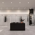 Modern Clothing Store Interior With Clothes On Racks Mirror Sofa And Display Table