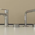 Two Chrome Modern Faucets With Round Bases On Beige Wall Countertop