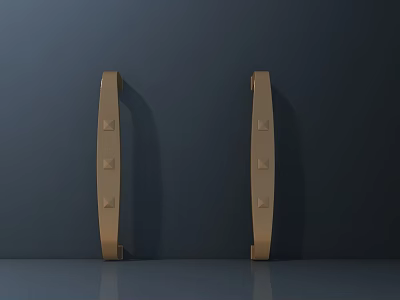 Golden Door Handles With Riveted Details Against Dark Background Showing Bottom Reflection 3d model