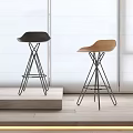 Modern Black And Tan Bar Stools With Metal Bases In Bright Interior With Large Windows