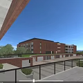 Modern Red Brick Multi Storey School Building With Students Activities And National Flag In Playground