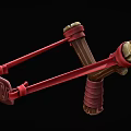 Traditional Wooden Slingshot Featuring Red Straps And Yellow Leather Wrapped Ends Design