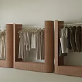 Modern Clothing Store with Stylish Clothing Racks Hanging Neutral Tones Apparel in Minimalist