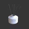 White Ceramic Home Fragrance Bottle With Black Reed Sticks And White Jasmine Scent