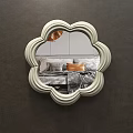 Flower Shaped Mirror on Brown Wall Reflecting Bedroom with Bed Pillows and Copper Pendant Light