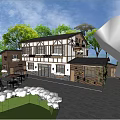 Two Story Building With Wood And White Exterior Windows Vines Surrounding Trees Outdoor Tables