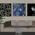 Modern Living Room With Three Decorative Paintings Light Gray Sofa Cushions And Green Plant