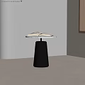 Minimalist Side Table with Black Tapered Base and White Top Holding Open Book 3d model