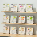 Ornament Decoration Set Featuring Colorful Monthly Calendar Designs On Wooden Shelves With Cartoon Patterns
