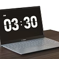 ASUS Laptop With Screen Showing AM 03 30 Placed On Wooden Table