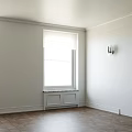 Cream White Hinged Doors With Decorative Panels In Light Wall Interior